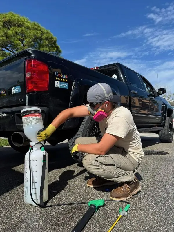 Neu's Power Washing technician preparing equipment for professional roof cleaning services in Wisconsin, ensuring safe