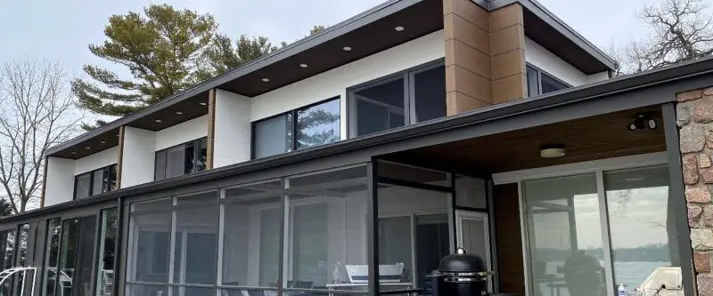 Clean, modern home exterior showcasing siding restoration and window cleaning services by Neu’s Power Washing
